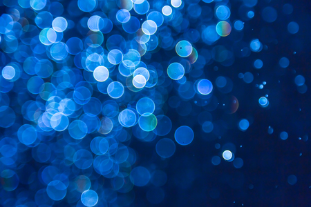 Blue glitter bokeh lights bokeh defocused backgroundの写真素材