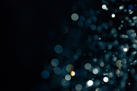 bokeh of lights on black backgroundの写真素材