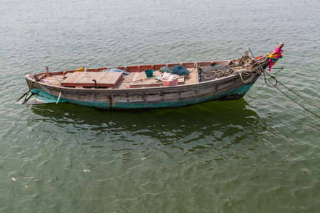 Orange wood fishing boat at Thailandの写真素材