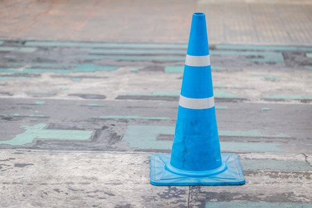 Blue street cone on the street backgroundの写真素材