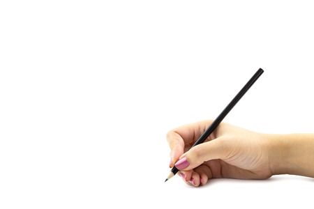 Female hand holdding black color pencils isolated on white backgroundの写真素材