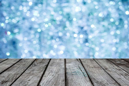 Blue bokeh with empty old top wooden table   backgroundの写真素材