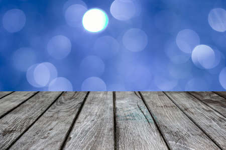 Blue bokeh with empty old top wooden table   backgroundの写真素材