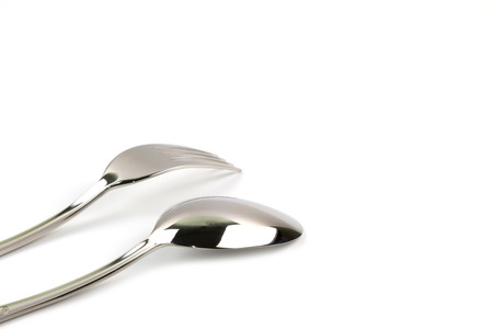 fork and spoon isolated on white backgroundの写真素材