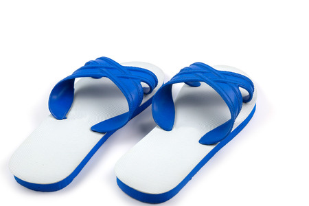 White and blue slippers isolated on white backgroundの写真素材