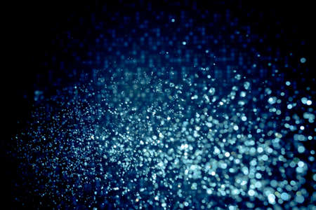 blue bokeh background from water and lightの写真素材
