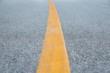 Close up of yellow line  on the road background