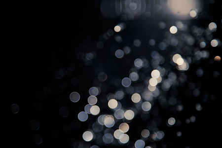 bokeh of lights on black backgroundの写真素材