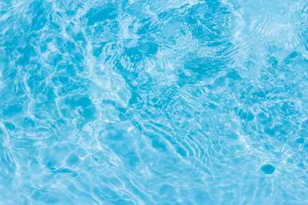 swimming pool with sunny reflections backgroundの写真素材