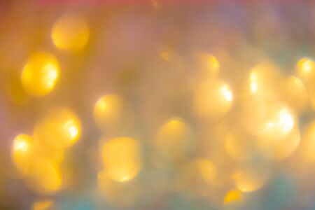 Christmas abstract background with gold bokeh defocused lightsの写真素材