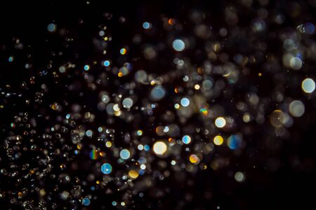 Luxurious Black bokeh texture on black backgroundの写真素材