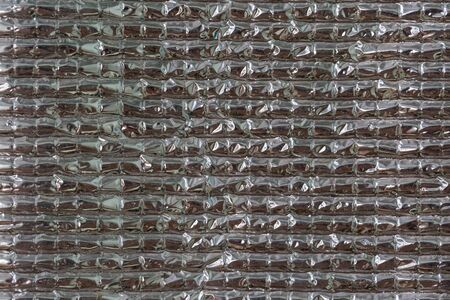 Close-up of aluminum foil sheet protect heat to the house