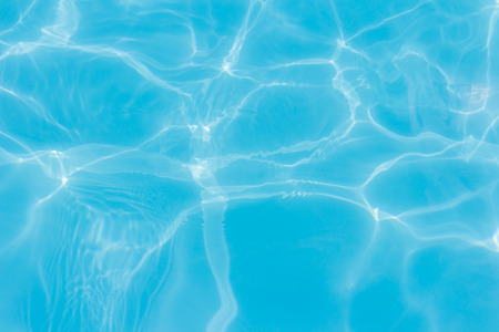 water in swimming pool rippled water detail backgroundの写真素材