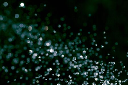 Colorful bokeh on black use for backgroundの写真素材