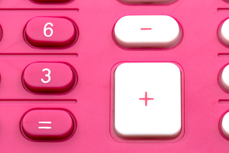 Pink calculator on white backgroundの写真素材