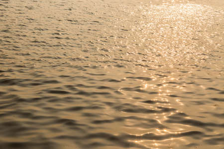 Surface water in the sunset time sunset water backgroundの写真素材