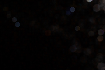 Bokeh on black background use for backgroundの写真素材