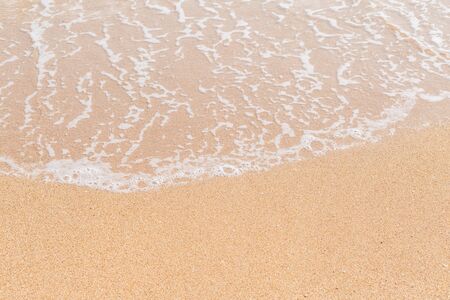 Wave of the sea on the sandy beach nackground