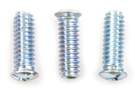 screwed screws nuts against isolated on white backgroundの写真素材