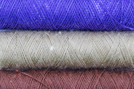 Color thread spool isolated on white background
