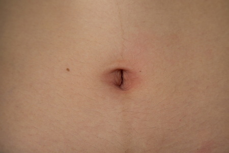 navel of the stomach of womanの写真素材