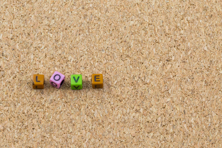 Letters love on cork board backgroundの写真素材