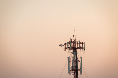 Telecommunications tower on sun set timeの写真素材
