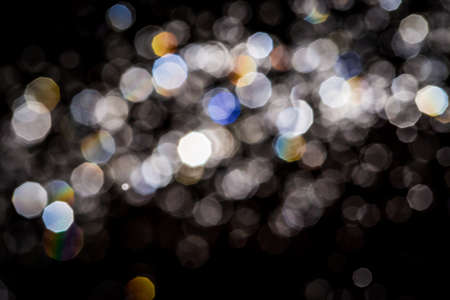 Abstract bokeh  texture on black backgroundの写真素材