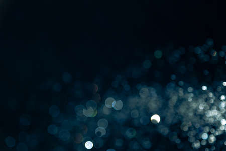 Vintage blur bokeh defocused on black  backgroundの写真素材