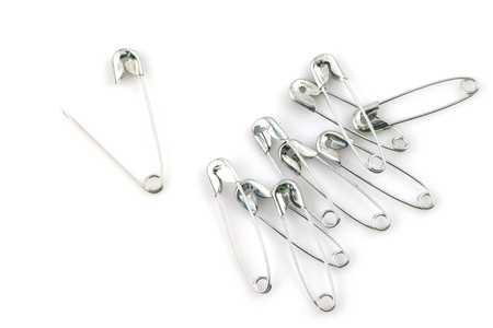 Bunch of safety pins isolated on white backgroundの写真素材