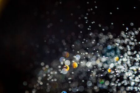 Vintage blur bokeh defocused on black  backgroundの写真素材
