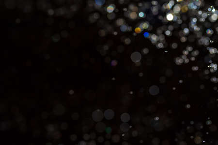 Bokeh on black background use for backgroundの写真素材