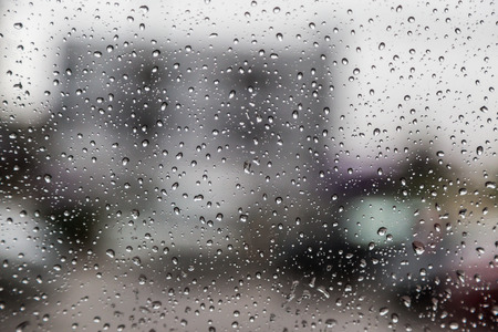 Water drop on glass backgroundの写真素材