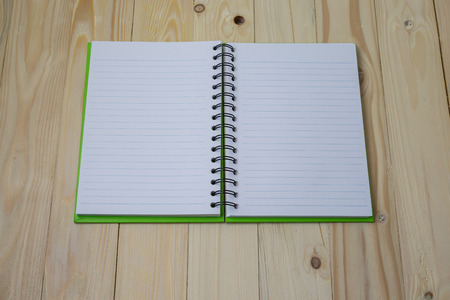 Blank recipe book on textured wood background
