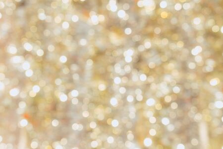 Abstract gold bokeh blur of soft light backgroundの写真素材