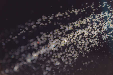 Colorful blur bokeh defocused on black backgroundの写真素材