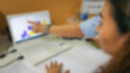 Blur photo of young business crew working with managers analyze plans, papers backgroundの写真素材