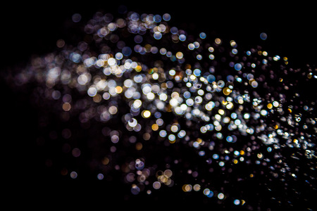 Colorful Bokeh on black backgroundの写真素材