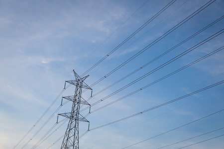 High voltage post tower with blue sky before sunset background.の写真素材