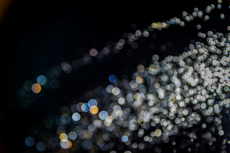 Colorful blur bokeh defocused on black backgroundの写真素材