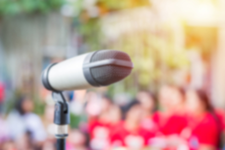 Close up of microphone in public place with blur backgroundの写真素材