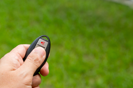 Car remote control on green background