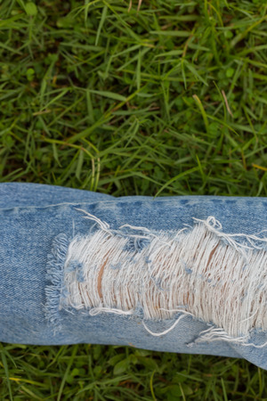 Female torn jeans backgroundの写真素材