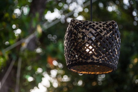 Wood lamp on tree with bokeh backgroundの写真素材
