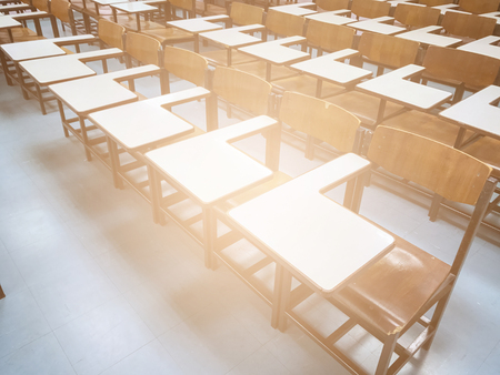 Wooden chairs in the classroom backgroundの写真素材