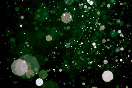 Abstract blur green bokeh with black background