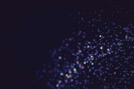 Colorful Bokeh on black backgroundの写真素材