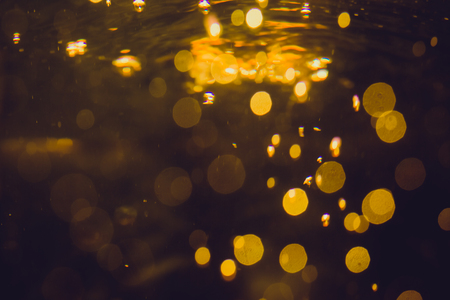 Luxury Gold abstract bokeh on black backgroundの写真素材