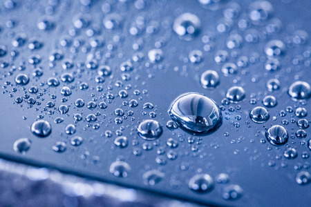 Water droplets on blue background