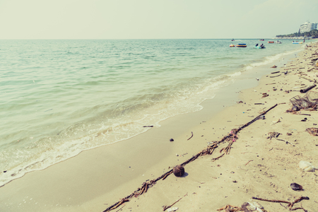 Plastic junk garbage dirty on the beach environment pollution backgroundの写真素材
